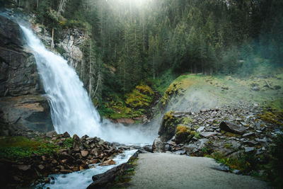 Scenic view of waterfall in forest