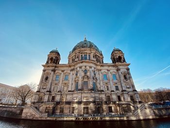 Low angle view of berliner dom against blue sky