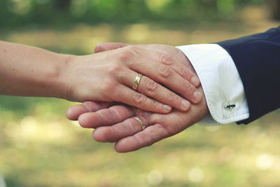 Close-up of couple holding hands