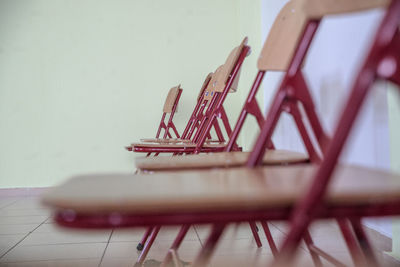 Close-up of empty chairs on table at home