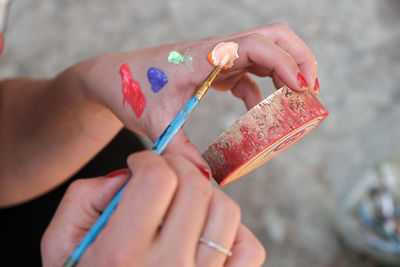 Broken hand of woman using paintwork