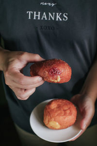 Midsection of man holding food