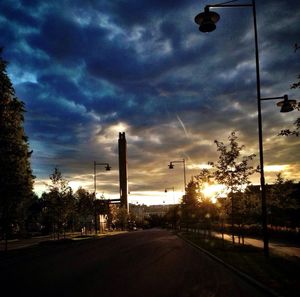 Road against cloudy sky at sunset