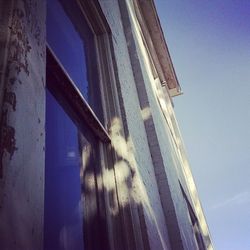 Low angle view of built structure against blue sky