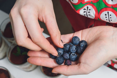 Close-up of woman holding fruit