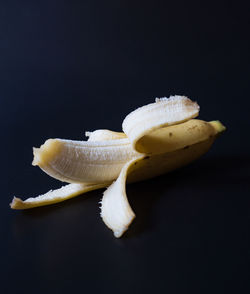 Close-up of banana against black background