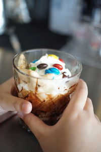 Midsection of person holding ice cream