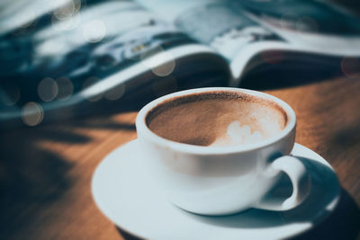 Close-up of coffee cup on table