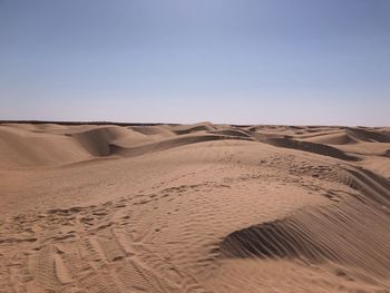 Scenic view of desert against clear sky