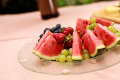 Close-up of fruits in plate on table