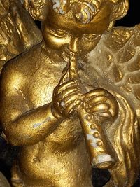 Close-up of angel statue on temple outside building