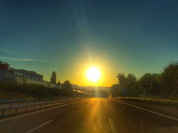 Empty road at sunset