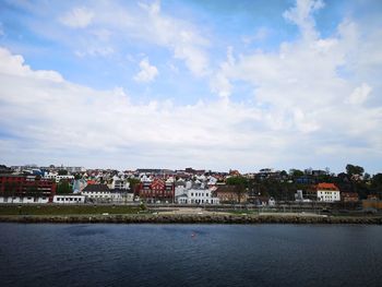 River by town against sky