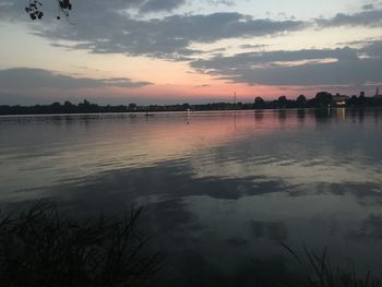 Scenic view of lake against sky during sunset