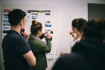 Rear view of people photographing