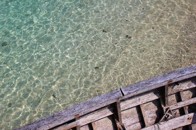 High angle view of boardwalk by swimming pool