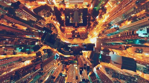 High angle view of city lit up at night