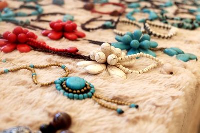 High angle view of colorful jewelry for sale at store