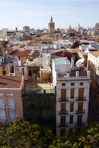 Houses in city against clear sky