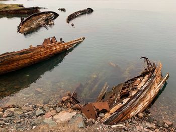 High angle view of abandoned boat moored at shore