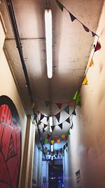 Low angle view of illuminated lanterns hanging from ceiling