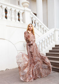 Portrait of young woman on staircase