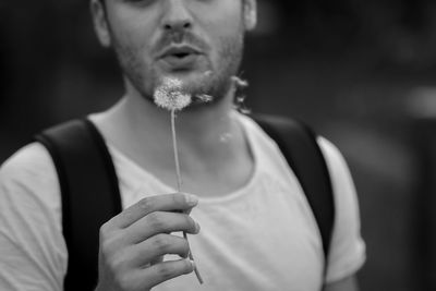 Close-up of man holding camera