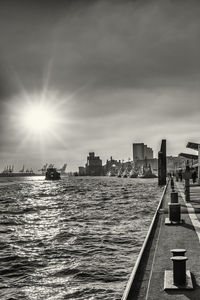 Panoramic view of sea and buildings against sky