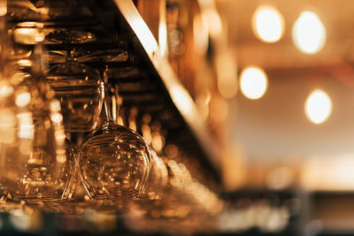 Close-up of illuminated light bulb on table