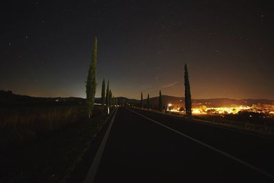 Illuminated road at night