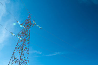 Electricity pylons in a mountain place. origin, transport and need for electricity. eletricity grid.