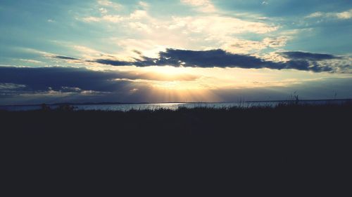 Scenic view of silhouette land against sky during sunset