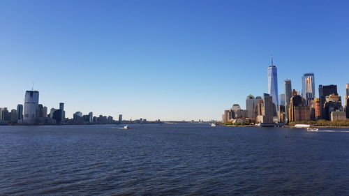 View of buildings in city against clear sky