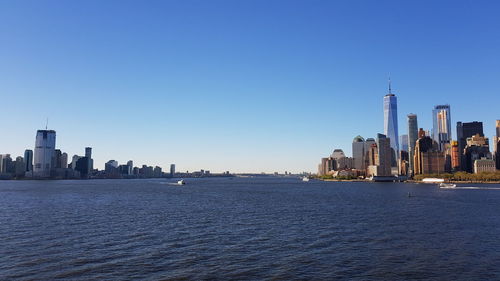 View of buildings in city against clear sky