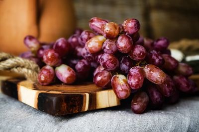 Close-up of grapes on table