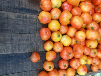 Directly above shot of tomatoes for sale at market stall