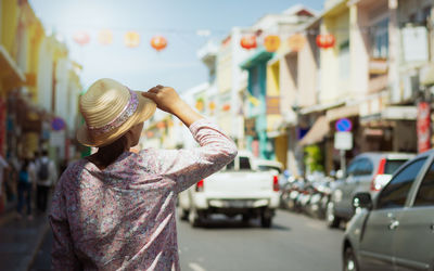 Rear view of man standing on street