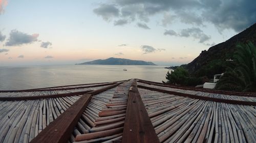 Scenic view of sea against cloudy sky