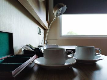 Coffee cup on table at home