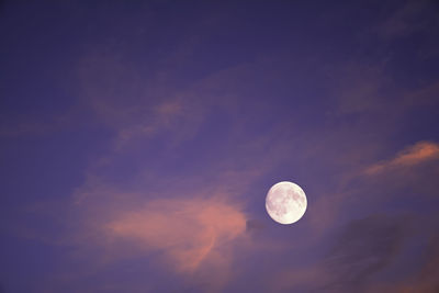 Low angle view of moon against sky during sunset