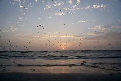 Scenic view of sea against sky at sunset