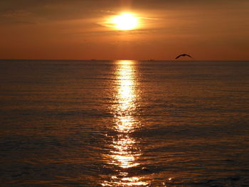 Scenic view of sea at sunset