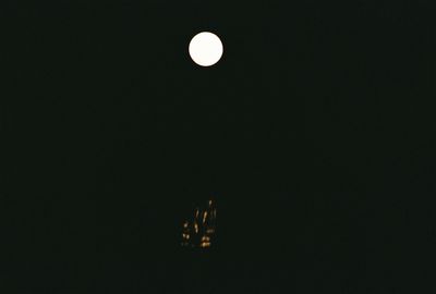 Low angle view of moon against sky at night