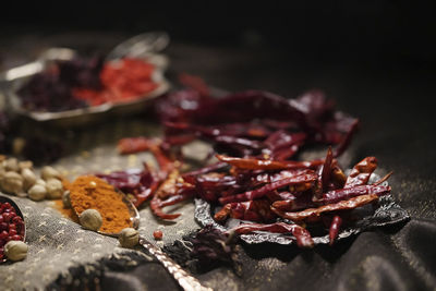 Close-up of red chili peppers on table