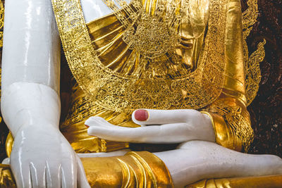 Close-up of the sitting buddha in rangoon, myanmar