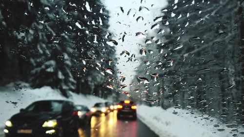 Raindrops on glass window of rainy season