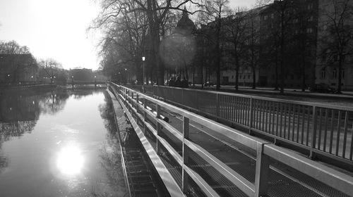 Scenic view of lake in city against sky