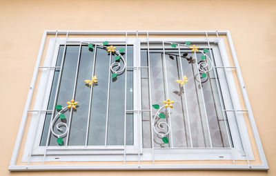 Low angle view of glass window of building