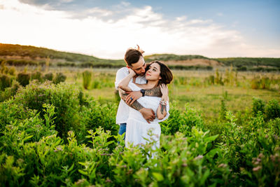 Young couple on plants