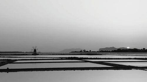 Scenic view of field against sky during winter